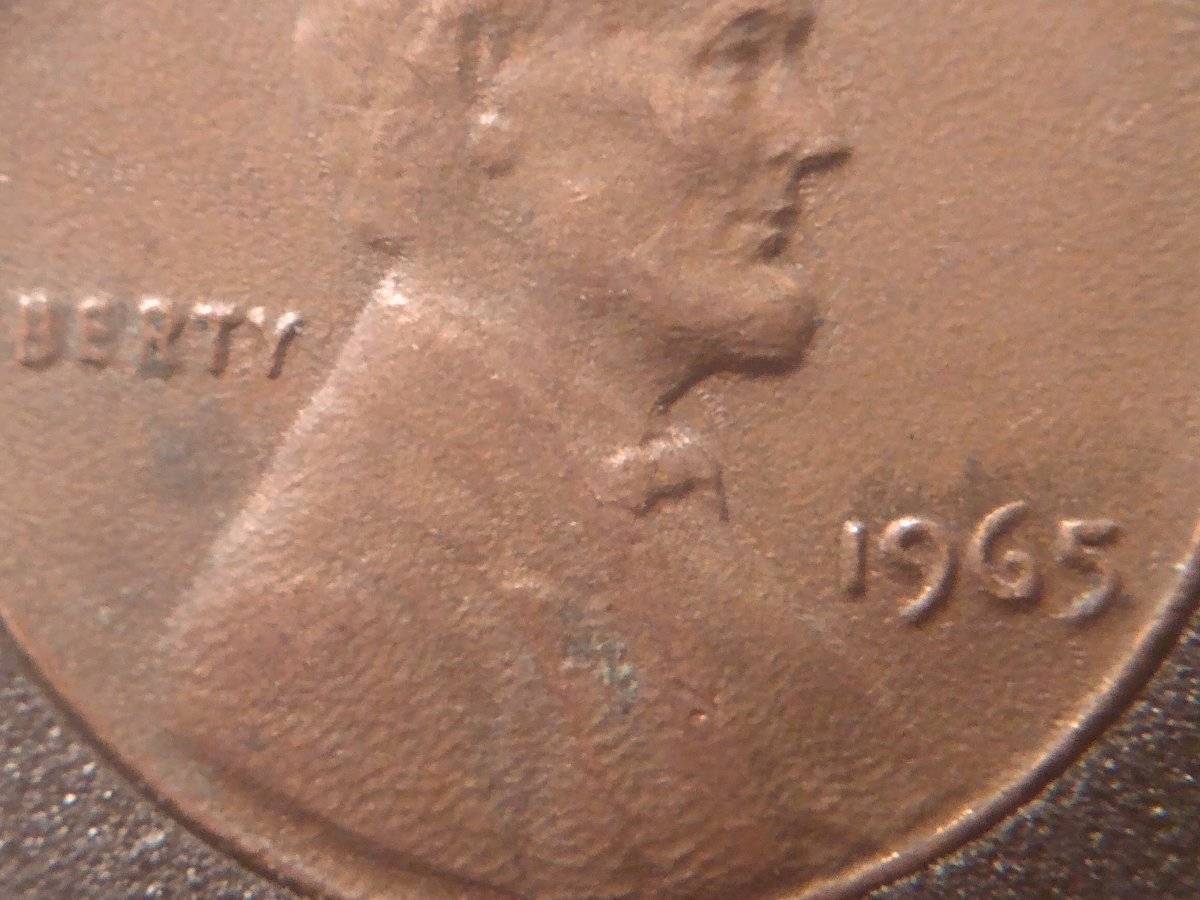Weird-Looking-1965-Pennies-Possible-Struck-Through